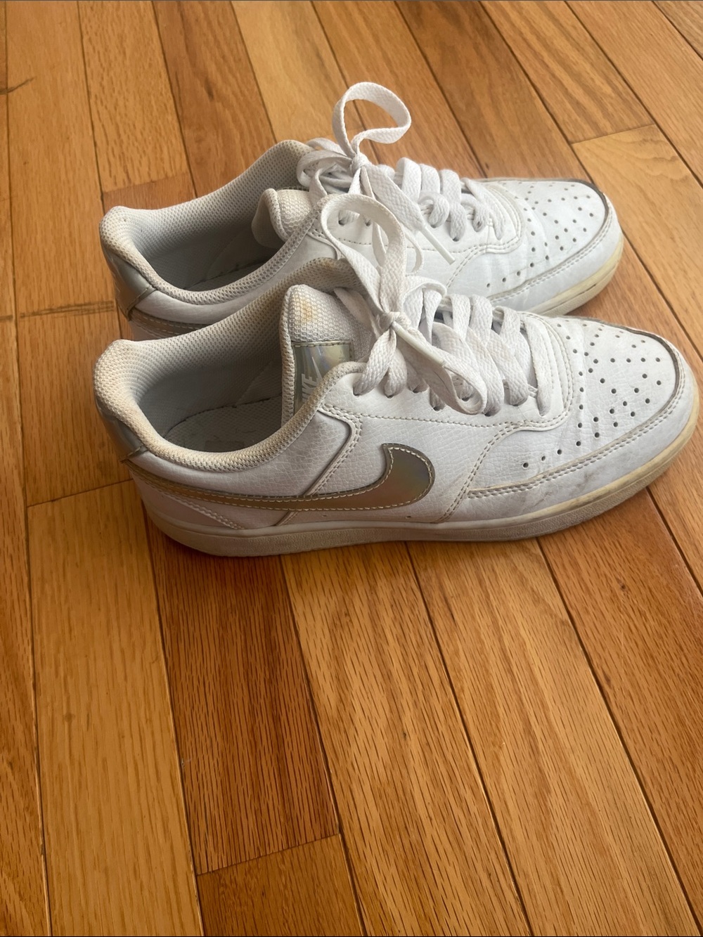 Nike White Low-Top Sneakers with Silver Swoosh Accent